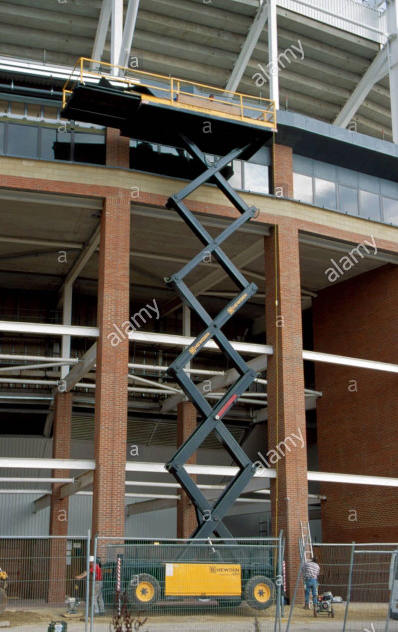 scissor lift being used to permit the inspection of stadium of light A4EECC